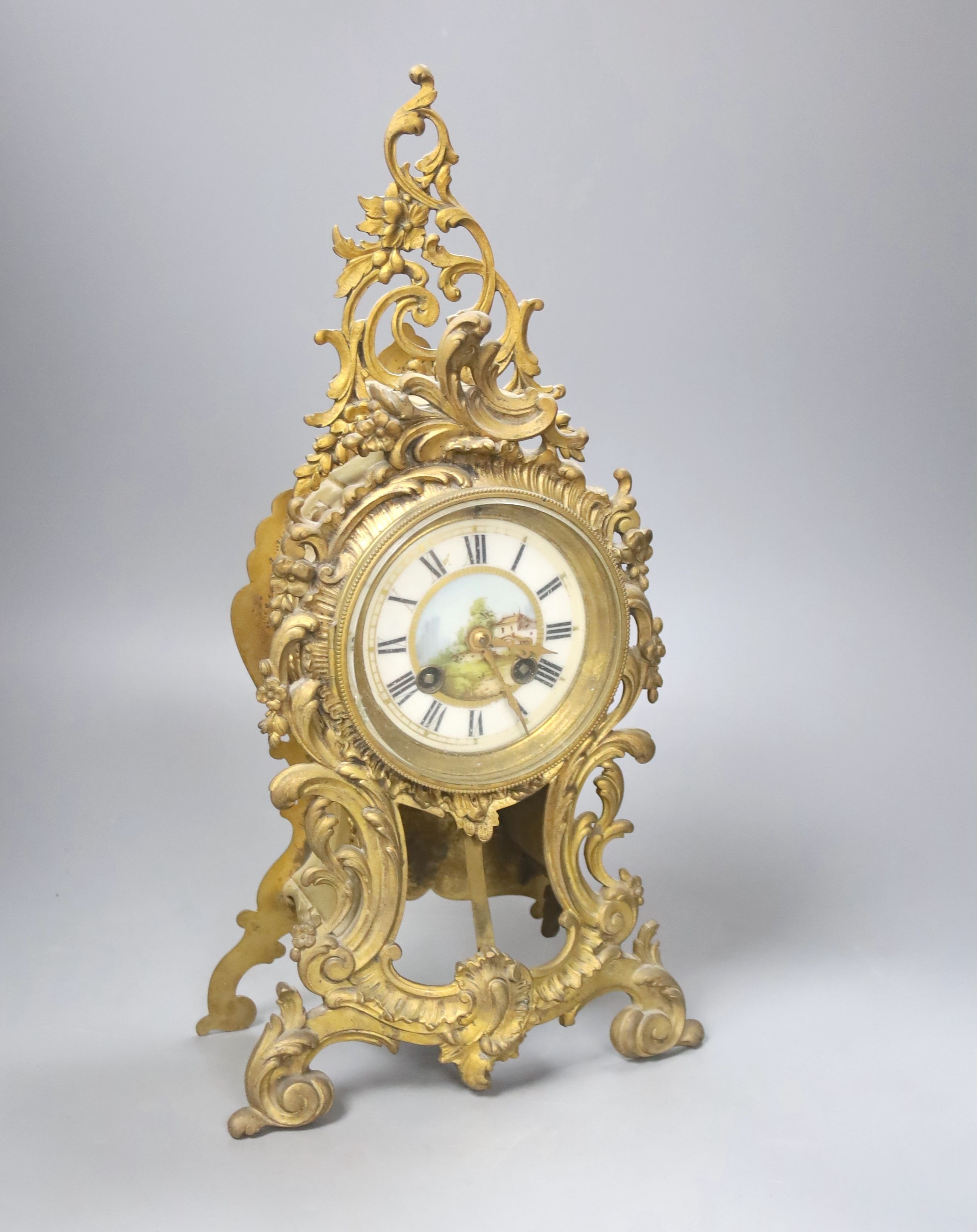 A late 19th century French gilt brass mantel clock, 40 cm high.